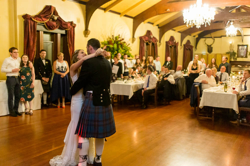 Bride and groom in Larnach Castle gardens